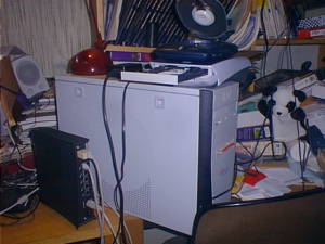 Computer on chaotic desk