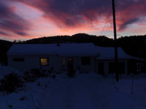 House in winter sunset