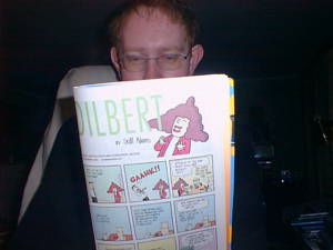 Reading Dilbert comic book