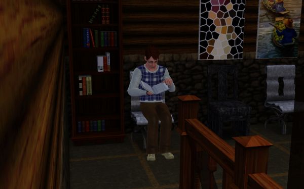 Male sim reading book in a dimly lit room