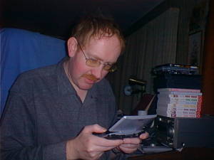 Middle-aged man with handheld game